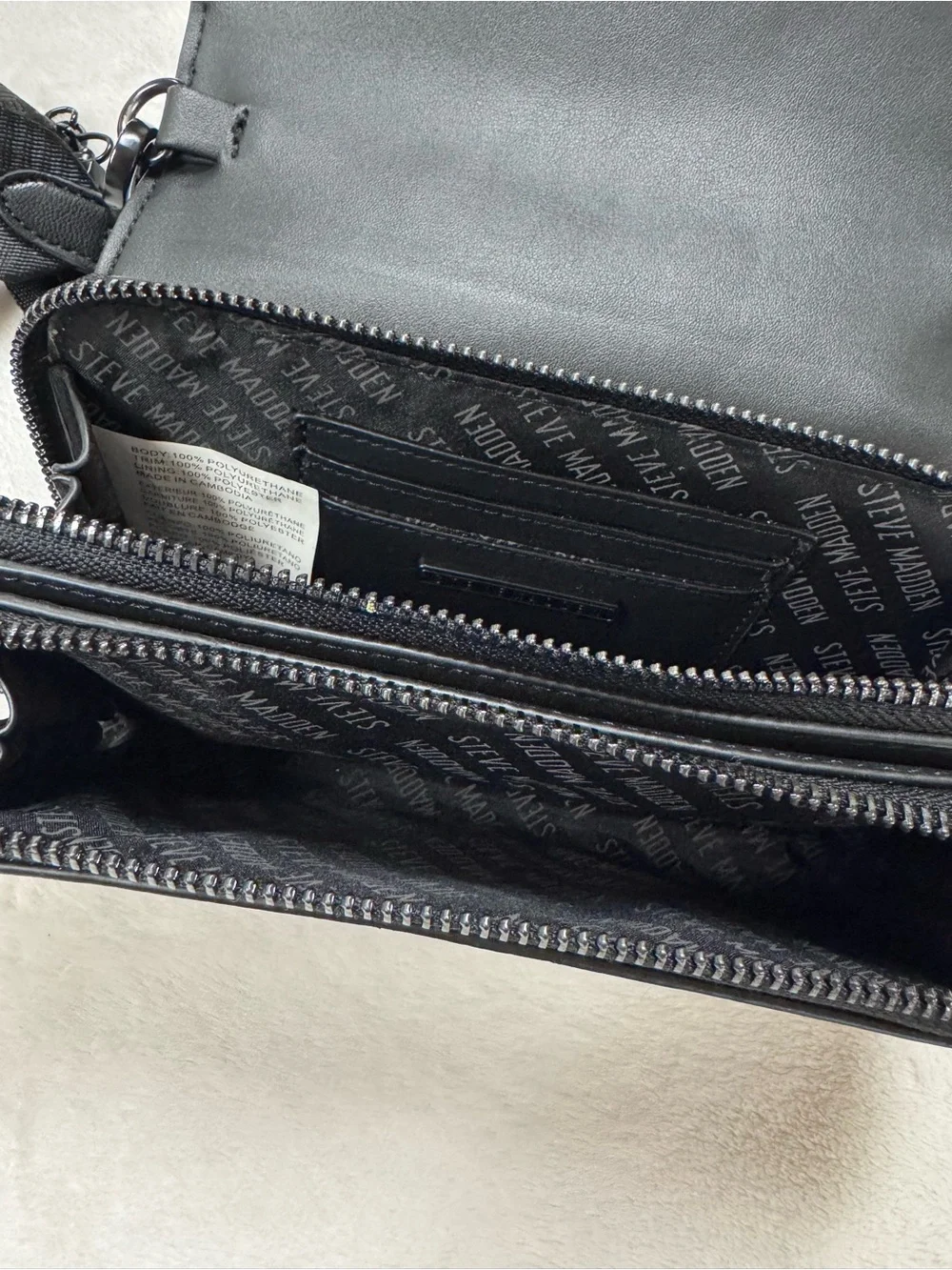 Steve Madden Black Embossed Logo Crossbody Bag.